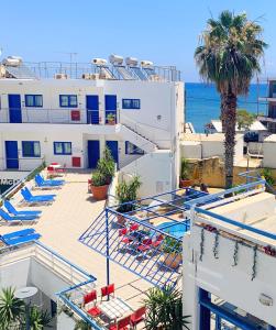 a view of the ocean from the balcony of a hotel at Kassavetis Center - Hotel Studios & Apartments in Hersonissos