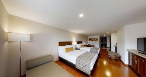 Cama o camas de una habitación en Hotel Estelar Suites Jones