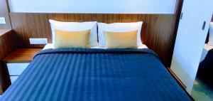 Postel nebo postele na pokoji v ubytování UTM Hotel & Residence