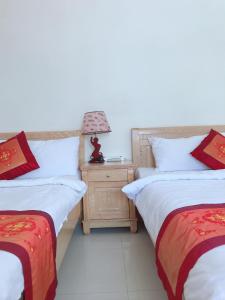 Giường trong phòng chung tại Kim Hương Homestay