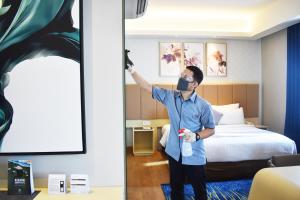Postelja oz. postelje v sobi nastanitve Luminor Hotel Airport Sidoarjo By WH , Best Choice and Strategic Location with a Rooftop area in Town
