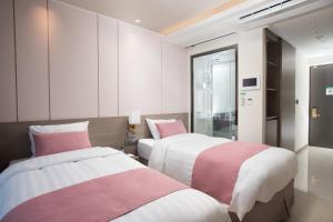 Ein Bett oder Betten in einem Zimmer der Unterkunft Utop Boutique Hotel&Residence