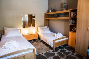 A bed or beds in a room at Eirinis House