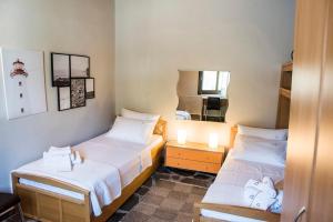 A bed or beds in a room at Eirinis House