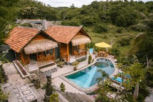 an aerial view of a resort with a swimming pool at The Lanjang valley Bungalow in Nusa Penida