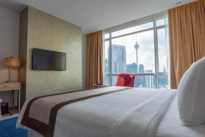Postel nebo postele na pokoji v ubytování Tamu Hotel & Suites Kuala Lumpur