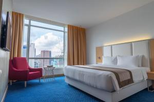 Postel nebo postele na pokoji v ubytování Tamu Hotel & Suites Kuala Lumpur