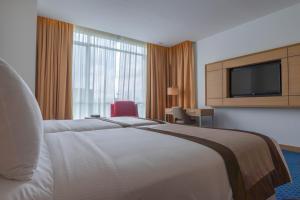 Postel nebo postele na pokoji v ubytování Tamu Hotel & Suites Kuala Lumpur