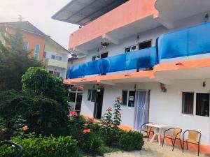 a building with a table and chairs in front of it at Casa Paloma in Costinesti +18 photos