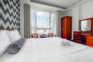 Postel nebo postele na pokoji v ubytování Ace Hotel Ben Thanh