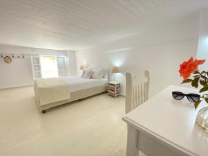 A bed or beds in a room at Patmos Sunshine Houses