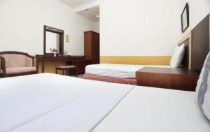 Hotel Syariah Cordovaにあるベッド