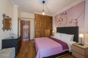 Posteľ alebo postele v izbe v ubytovaní Eleni's Family Villa