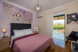 Posteľ alebo postele v izbe v ubytovaní Eleni's Family Villa + 37 fotografií