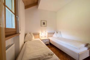 Posteľ alebo postele v izbe v ubytovaní Tischlerhof - Typ A mit Balkon