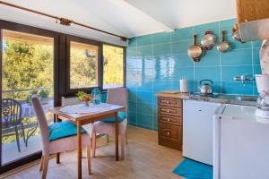 Kuchyňa alebo kuchynka v ubytovaní Apartments Mirella
