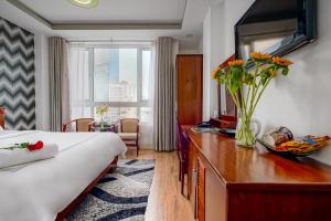 TV a/nebo společenská místnost v ubytování Ace Hotel Ben Thanh + 33 fotografií