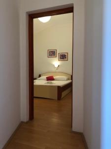 Кровать или кровати в номере Apartmani Anamar