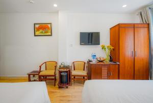 Postel nebo postele na pokoji v ubytování Ace Hotel Ben Thanh
