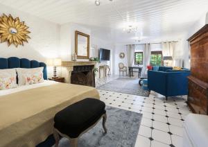 a large bedroom with a bed and a fireplace at Château du Châtelard | 2 persons in Montreux