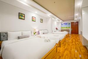 Postel nebo postele na pokoji v ubytování Ace Hotel Ben Thanh