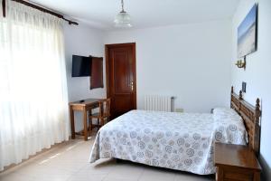 Posteľ alebo postele v izbe v ubytovaní Hotel Maruxa