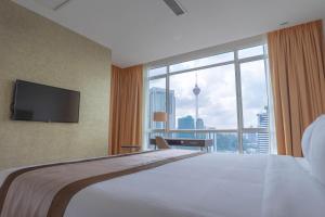 Postel nebo postele na pokoji v ubytování Tamu Hotel & Suites Kuala Lumpur