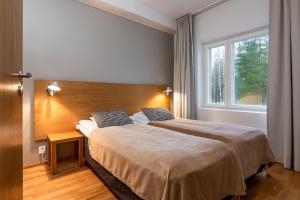 Postel nebo postele na pokoji v ubytování Finlandia Hotel Imatran Kylpylä Spa