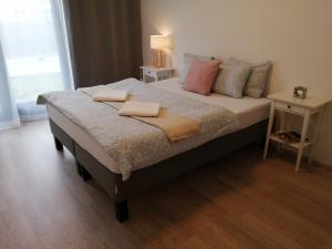 Postel nebo postele na pokoji v ubytování Prima Family Apartments