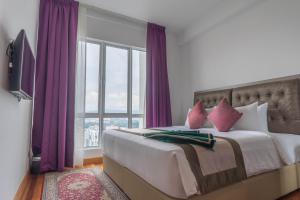 Postel nebo postele na pokoji v ubytování Tamu Hotel & Suites Kuala Lumpur