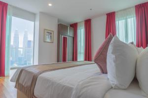 Postel nebo postele na pokoji v ubytování Tamu Hotel & Suites Kuala Lumpur