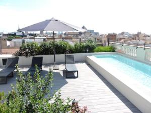 a swimming pool on the roof of a building at Hotel Raval House in Barcelona