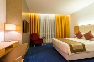 Postel nebo postele na pokoji v ubytování Tamu Hotel & Suites Kuala Lumpur