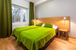Postel nebo postele na pokoji v ubytování Finlandia Hotel Imatran Kylpylä Spa