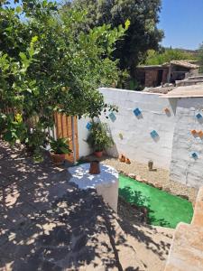 a backyard with a swimming pool and a tree at Dwelling Zara in Solèminis