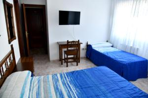Posteľ alebo postele v izbe v ubytovaní Hotel Maruxa