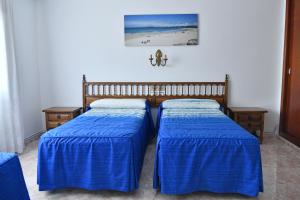 Posteľ alebo postele v izbe v ubytovaní Hotel Maruxa
