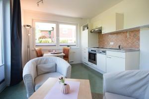 Kuchyň nebo kuchyňský kout v ubytování De Kanalkieker Apartmenthaus Meier