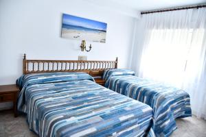 Posteľ alebo postele v izbe v ubytovaní Hotel Maruxa