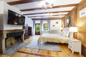 a bedroom with a bed and a fireplace at A castle spirit apartment in Château du Châtelard in Clarens