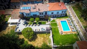 an aerial view of a house with a swimming pool at Ziyabey Konagi in Ayvalık