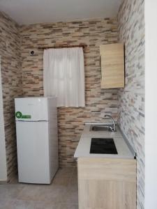 Kuchyň nebo kuchyňský kout v ubytování Vour 52