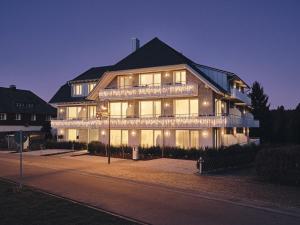 a large house is lit up at night at WaldFunkeln LODGE in Hinterzarten