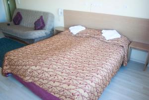 Postel nebo postele na pokoji v ubytování Carolina Hotel