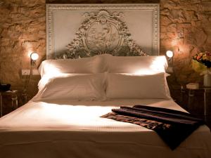Postel nebo postele na pokoji v ubytování Tenuta Ponziani Wine Resort&Spa + 37 fotografií