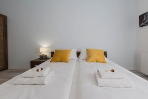 Posteľ alebo postele v izbe v ubytovaní City Break Gdańsk Rajska 8 Apartamenty