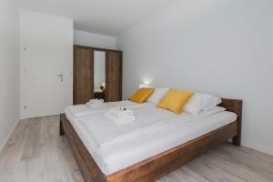 Posteľ alebo postele v izbe v ubytovaní City Break Gdańsk Rajska 8 Apartamenty