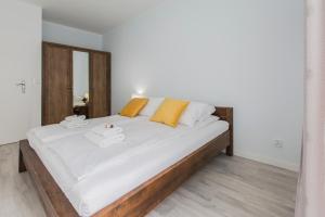 Posteľ alebo postele v izbe v ubytovaní City Break Gdańsk Rajska 8 Apartamenty