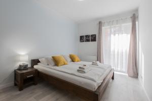 Posteľ alebo postele v izbe v ubytovaní City Break Gdańsk Rajska 8 Apartamenty