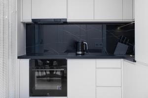 Kuchyňa alebo kuchynka v ubytovaní City Break Gdańsk Rajska 8 Apartamenty